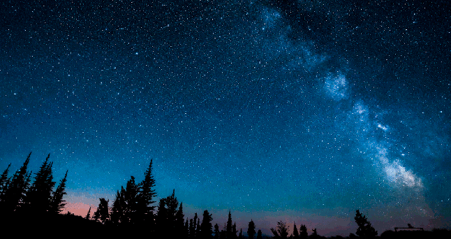 A GIF shows stars shooting across a night sky.