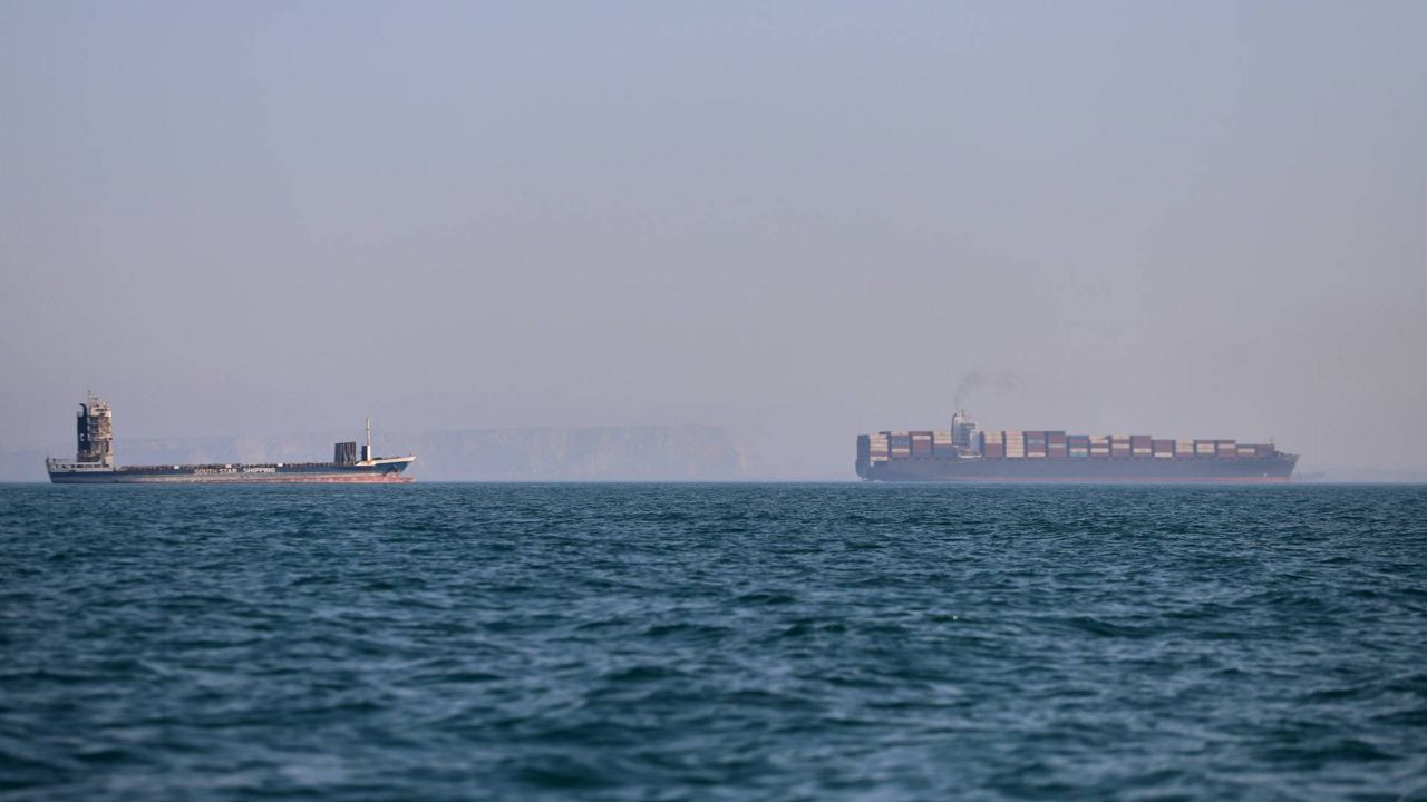 A container ship, right, and a cargo vessel are seen in the Strait of Hormuz off Bandar Abbas, Iran, Wednesday, June 17, 2026. (Amirhosein Khorgooi/ISNA via AP, File)