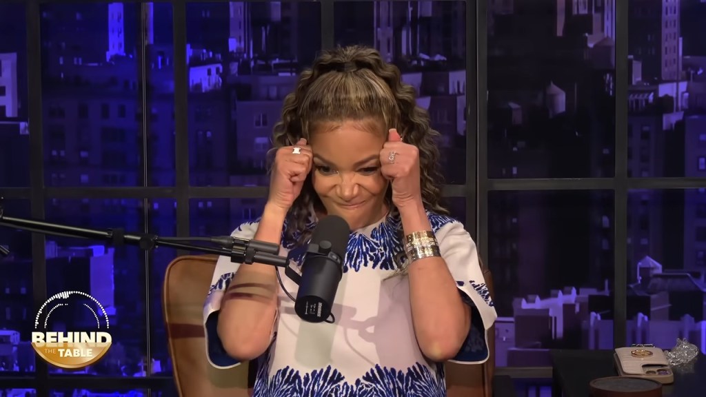 Sunny Hostin making a face with her hands near her temples.