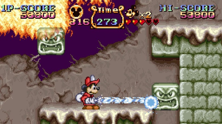 Mickey Mouse pushes a block with a stream of water in The Magical Quest Starring Mickey Mouse