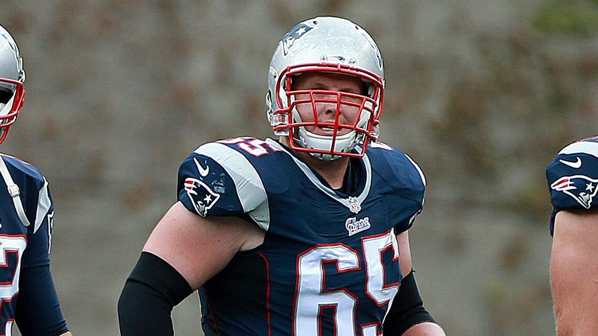 Tom Brady, Jordan Devey and Nate Solder walk off the field together.