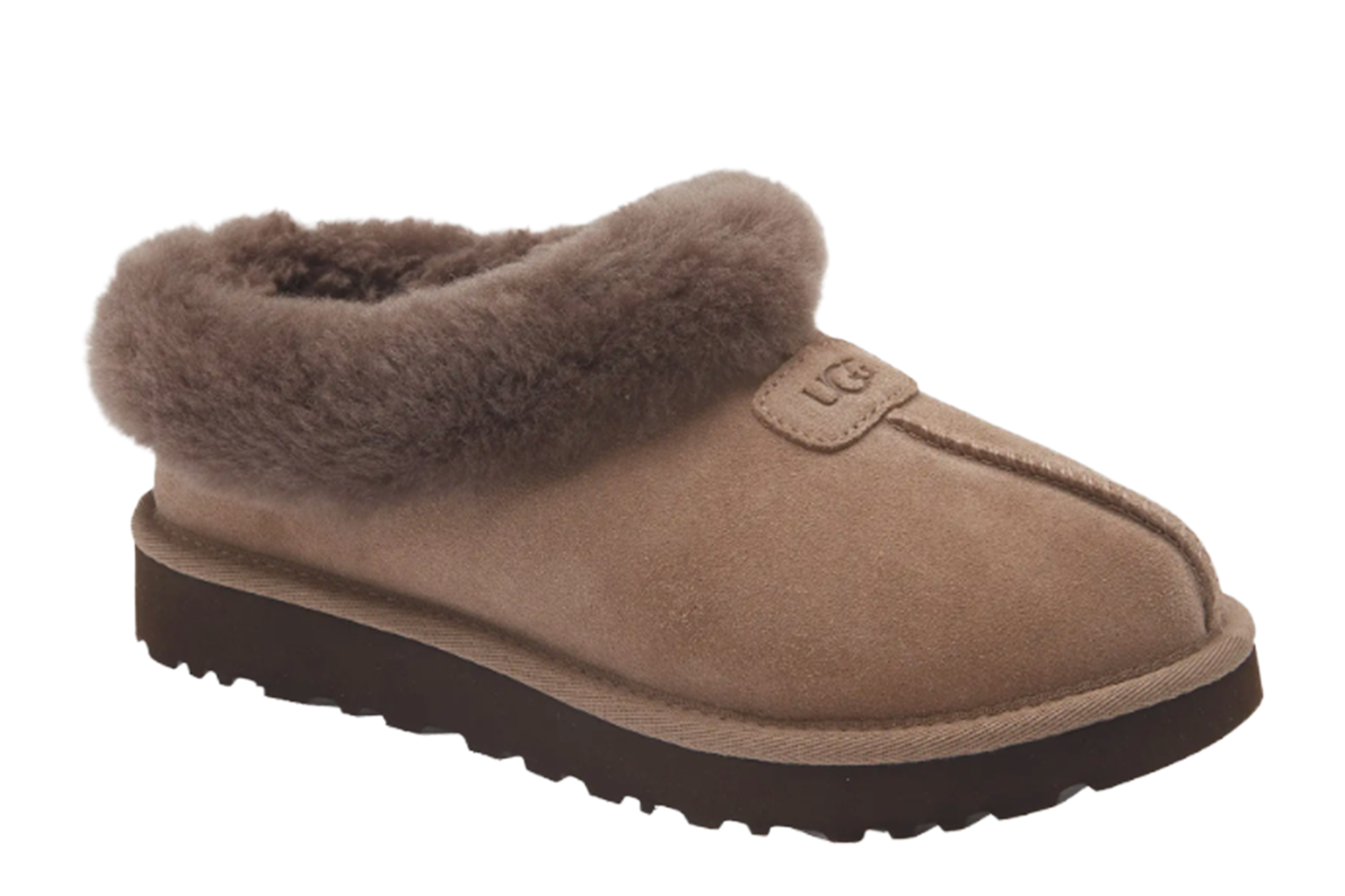 Ugg slipper in tan with a brown sole and fur lining.