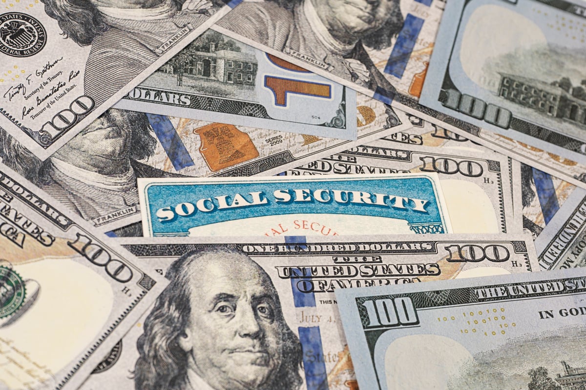 A Social Security card in a pile of cash.