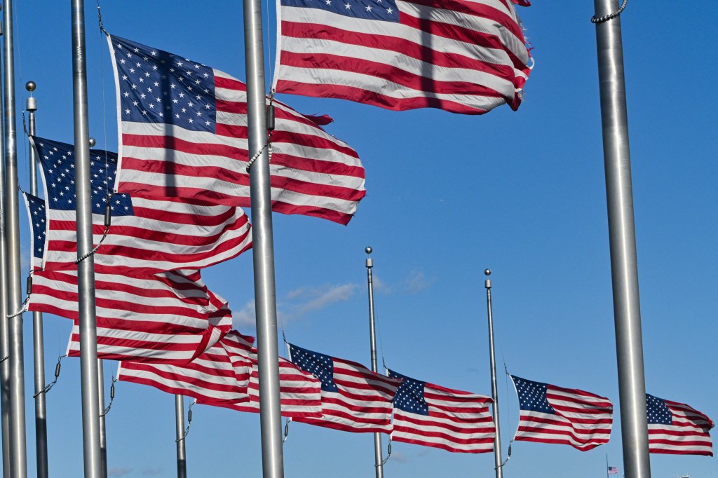 US flags fly at half-staff on the National Mall near the White House to honor former US President Jimmy Carter.