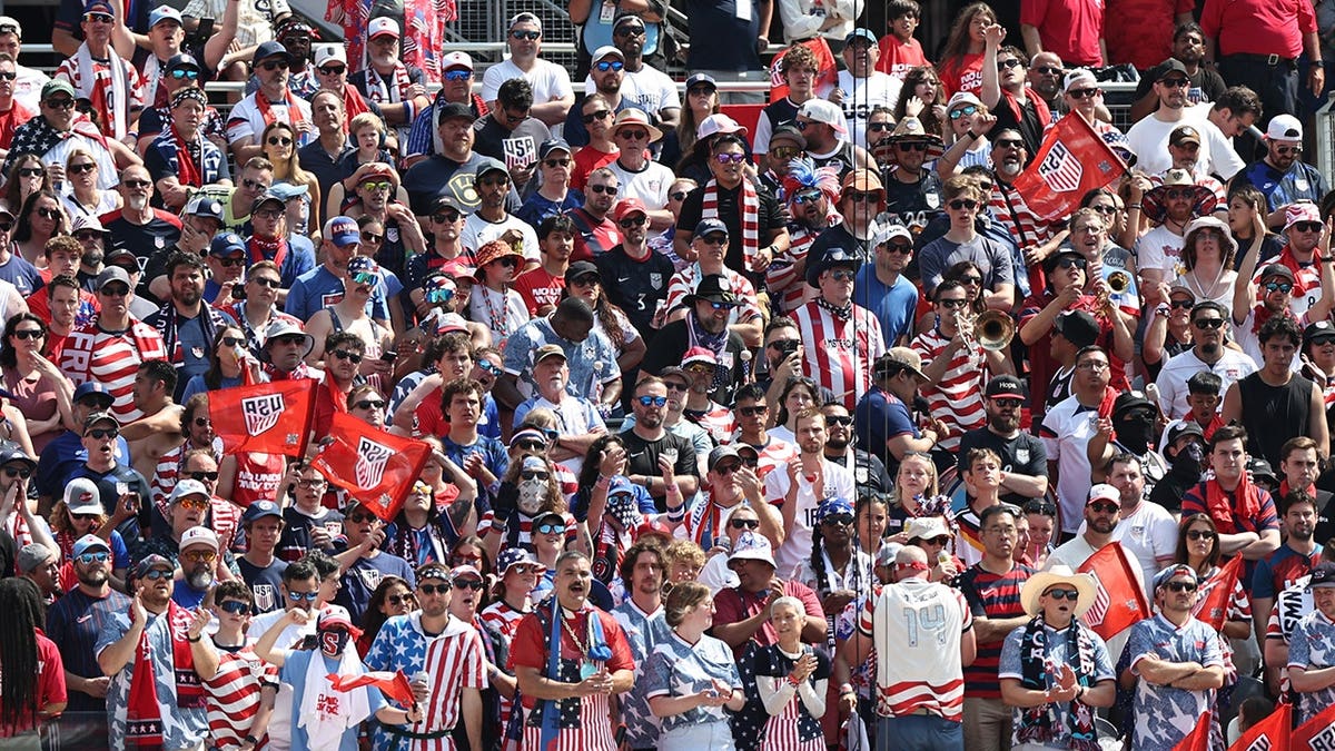 Fans of United States cheering during international friendly match at Soldier Field in Chicago