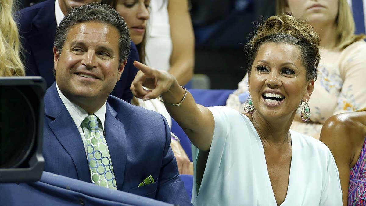 Vanessa Williams and her husband Jim Skrip standing together at an event.