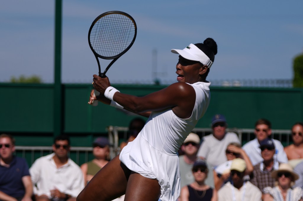Venus Williams hitting a return at Wimbledon.
