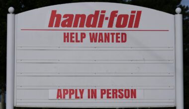 US jobless claims dip modestly to 215,000 last week