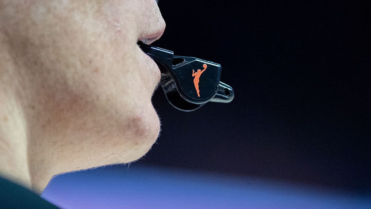 close up of WNBA referee's whistle