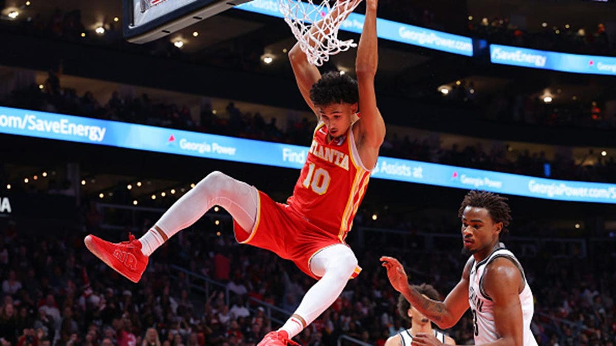 Zaccharie Risacher dunks the ball against the Brooklyn Nets at State Farm Arena.