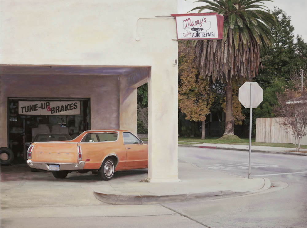 A faded street scene with an orange car parked near a motel or storefront, © Ann Mitchell.