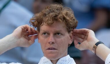 Jannik Sinner reacts after a match