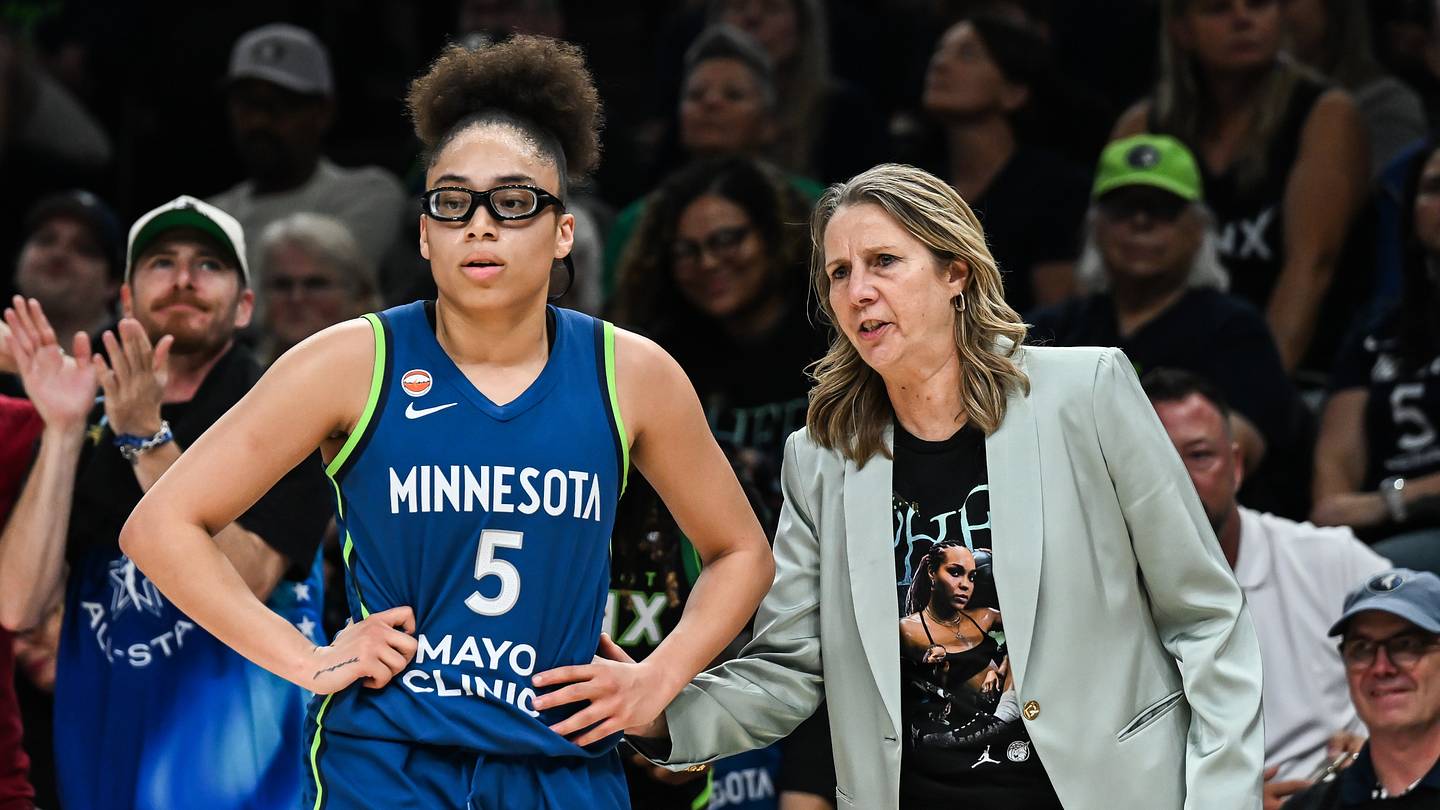Aug 9, 2026; Minneapolis, Minnesota, USA; Minnesota Lynx guard Olivia Miles (5) and head coach Cheryl Reeve look on during the second quarter against the Dallas Wings at Target Center. Mandatory Credit: Jeffrey Becker-Imagn Images