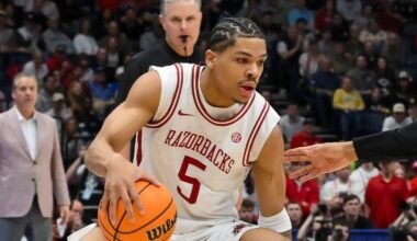 Mar 15, 2026; Nashville, TN, USA; Arkansas Razorbacks guard Darius Acuff Jr. (5) drives to the basket past Vanderbilt Commodores forward Devin McGlockton (99) during the first half during the men's SEC Conference Tournament Championship at Bridgestone Arena. Mandatory Credit: Steve Roberts-Imagn Images