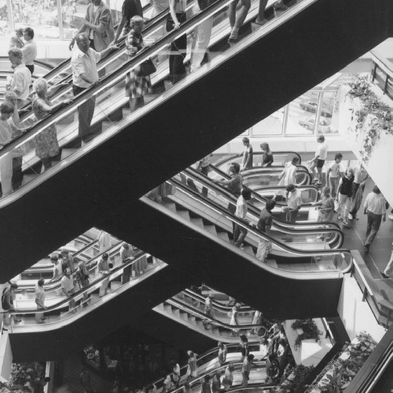 The library’s original zigzagging escalators became one of its most recognizable features, turning movement through the building into part of the architectural experience.