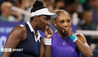 Venus Williams (left) speaks to Serena Williams during their US Open first-round doubles match in 2022