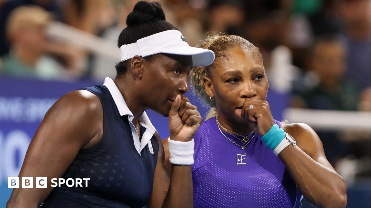 Venus Williams (left) speaks to Serena Williams during their US Open first-round doubles match in 2022