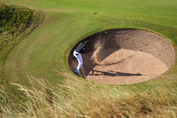 Miyu Yamashita, of Japan, plays a shot out of a bunker on the 3rd hole during the second round of the Women's British Open golf championship in Lytham St Annes, England, Friday, July 31, 2026. (AP Photo/Jon Super)