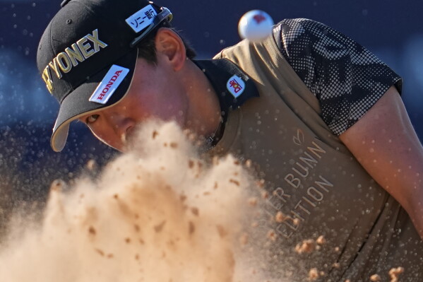 Chizzy Iwai, of Japan, plays a shot out of the bunker on the 17th green during the second round of the Women's British Open golf championship in Lytham St Annes, England, Friday, July 31, 2026. (AP Photo/Jon Super)