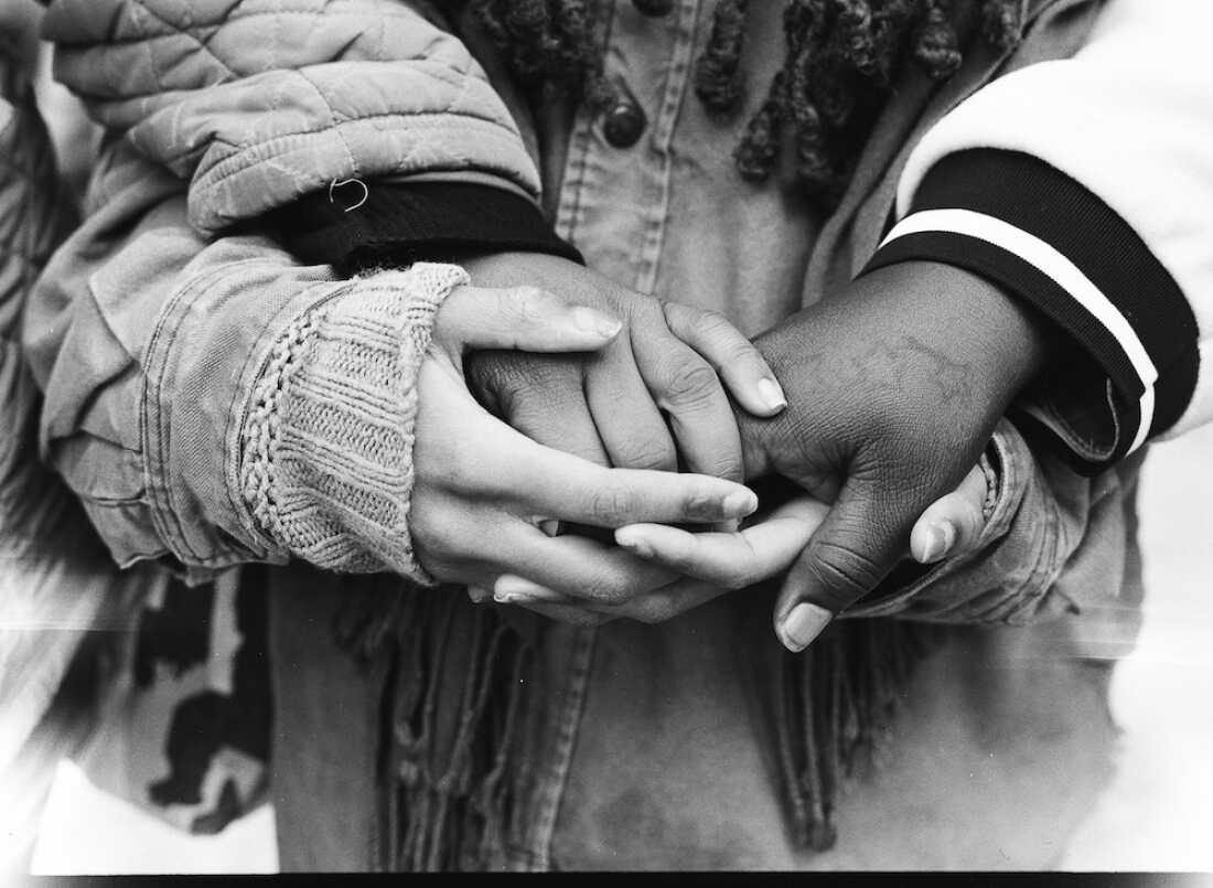 On their first time traveling by airplane from their home in South Carolina, Stevens' cousins Larrisha and Takera Myers stayed with Morgan, one of Stevens’ best friends who was born and raised in North Carolina. Here, the three hold hands in the Bedford–Stuyvesant neighborhood of Brooklyn, N.Y.