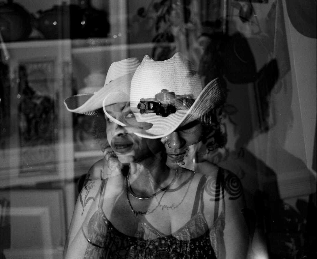 Mari-Eva Mendes in one of her favorite hats from her time in Oklahoma, a look that recalls Midwestern and Southern dress and carries echoes of Black cultural adornment.