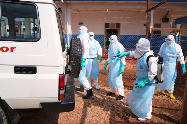 Health workers disinfects an ambulance at Ebola Treatment Center at Bunia General Hospital in Ituri, Congo, Wednesday, July 22, 2026. (AP Photo/Dirole Lotsima Dieudonne)