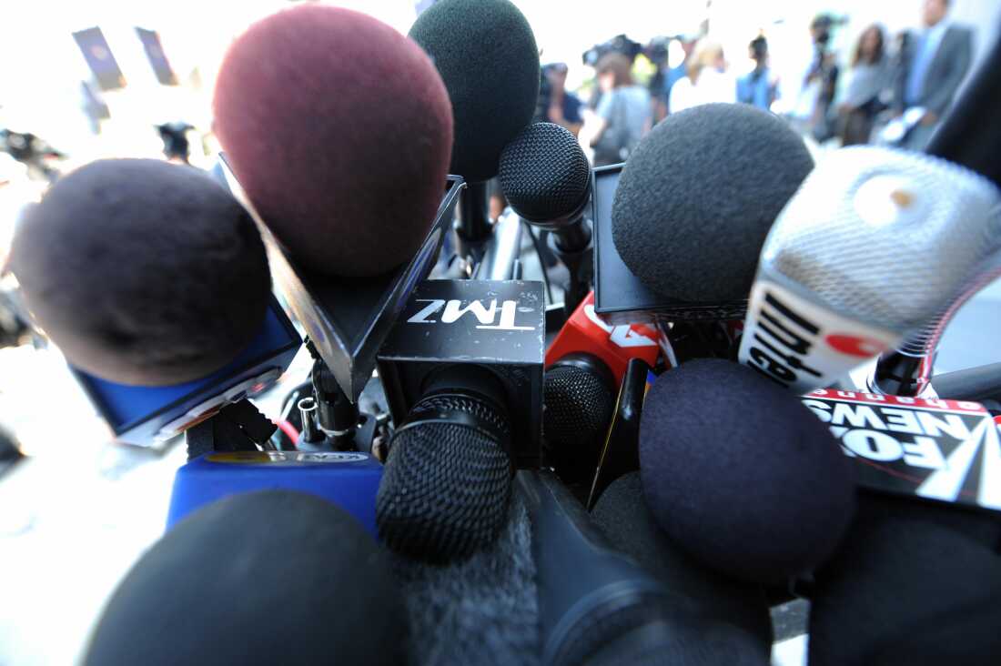 A microphone labeled with TMZ's logo is seen among a cluster of other media outlets' microphones in Los Angeles on July 5, 2009.