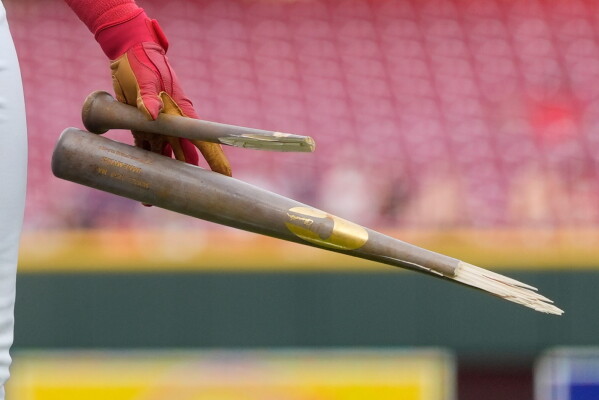 Cincinnati Reds' Dane Myers holds the bat that he broke after popping out during the third inning of a baseball game between the Cincinnati Reds and the Athletics in Cincinnati, Wednesday, Aug. 5, 2026. (AP Photo/Carolyn Kaster)