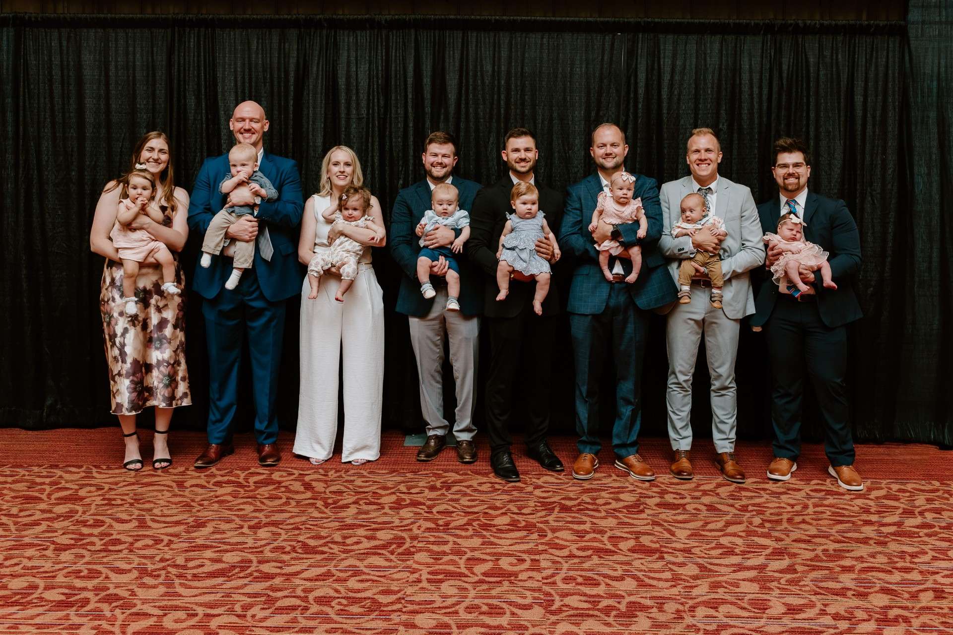Eight of sixteen residents of the Smoky Hill Family Medicine Residency welcomed babies. (Left to Right)  Andrea Vierthaler, MD, Jack Harrigan, MD, Sara Teague, DO, Landon Younger, DO, Nate Clennan, MD, Kyle McGatlin, MD, Josiah McAllister, MD and Orion Battaglia, MD - Christy K Photography, photo