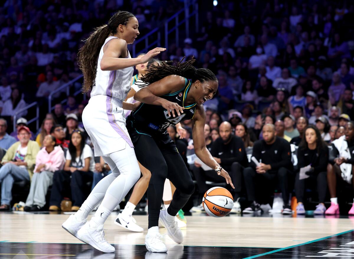 Sparks forward Nneka Ogwumike, right, reacts after being fouled by Golden State center Kiah Stokes.