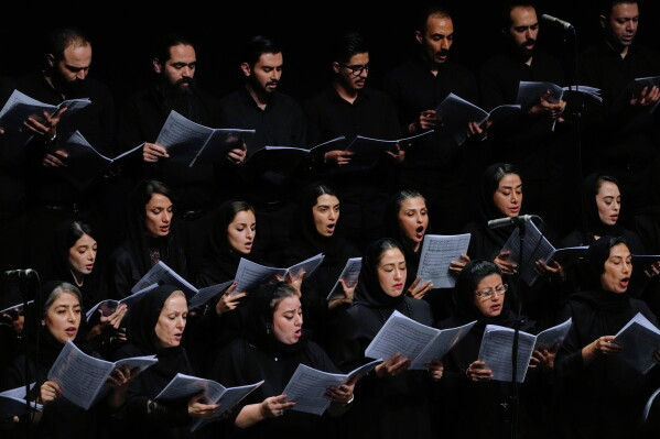 Choir performs in a Tehran Symphony Orchestra performance at Unity Hall in Tehran, Iran, Thursday, Aug. 6, 2026. (AP Photo/Vahid Salemi)
