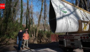 Atlanta reused a nearly 7,000-pound wind turbine blade as a 50-foot pedestrian bridge; the retired Colorado blade now carries walkers through Beaverbrook Park