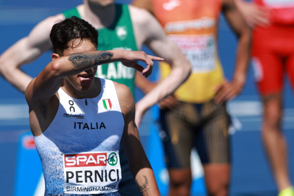 Francesco Pernici of Italy gestures as he gets ready to compete in a men's 800 meters semifinal at the European Athletics Championships in Birmingham, England, Wednesday, Aug. 12, 2026. (AP Photo/Morgan Harlow)