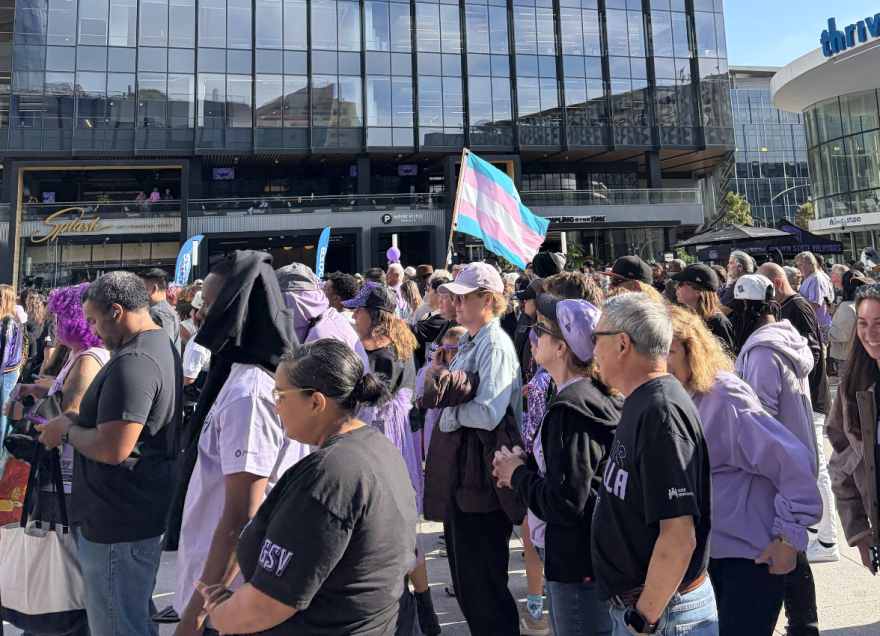 Outside of Chase Center, or "Ballhalla," as its affectionately known, trans rights advocates wave a transgender pride flag.