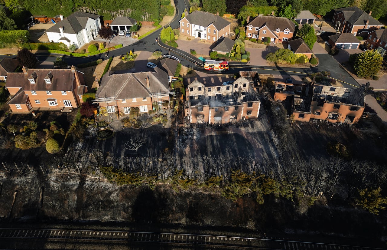 A drone view of burnt houses after a large fire.