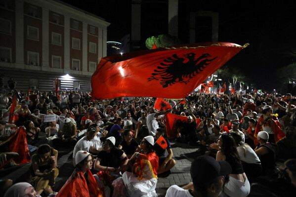 Protesters take part in a rally in Tirana, Saturday, June 20, 2026, against a coastal development project in western Albania linked to Donald Trump's son-in-law Jared Kushner, which is facing growing opposition from environmental advocates and has triggered daily protests in the Albanian capital. (AP Photo/Hameraldi Agolli)