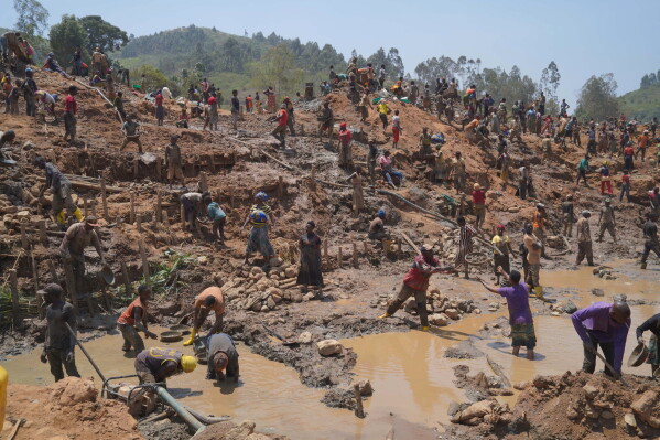 People search for gold at a mining site in Iga-Barrière, Ituri province, eastern Congo, Friday, Aug. 14, 2026. (AP Photo/Dieudonne Dirole)