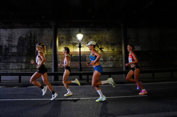 Athletes compete in the women's marathon at the European Athletics Championships in Birmingham, England, Sunday, Aug. 16, 2026. (AP Photo/Petr David Josek/Pool)