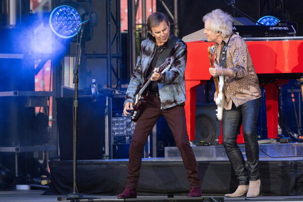 Journey guitarists Jonathan Cain, left, and Todd Jensen in 2025. (AP Photo/Phil Long, File)