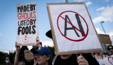 A sign opposed to AI is held during a protest against AI data centers in Vancouver, British Columbia, Canada, on Saturday, June 27, 2026. Canadians aren't universally sold on building sovereign compute, with early signs of protest against AI server farms in British Columbia and Manitoba. Photographer: Ethan Cairns/Bloomberg via Getty Images
