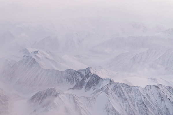 Snow covers the mountains of the Brooks Range in the Arctic National Wildlife Refuge, Oct. 14, 2024, near Kaktovik, Alaska. (AP Photo/Lindsey Wasson, File)