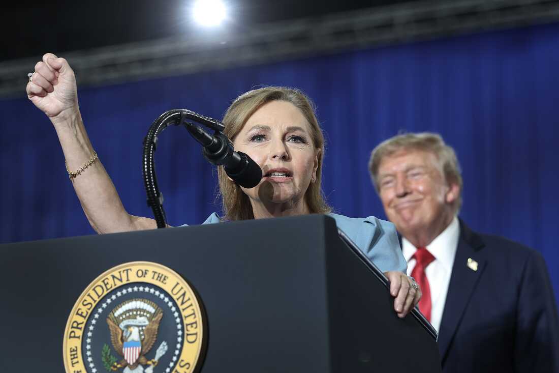 President Donald Trump listens to U.S. Sen. Darline Graham during a campaign rally on August 21, 2026 in Myrtle Beach, South Carolina. President Trump traveled to South Carolina to support Graham ahead of Tuesday's runoff election against Rep. Ralph Norman.