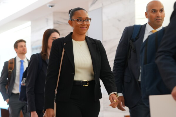 McKenna West, left, arrives with her legal team for a court hearing in Dallas, Tuesday, Aug. 25, 2026. (AP Photo/LM Otero)