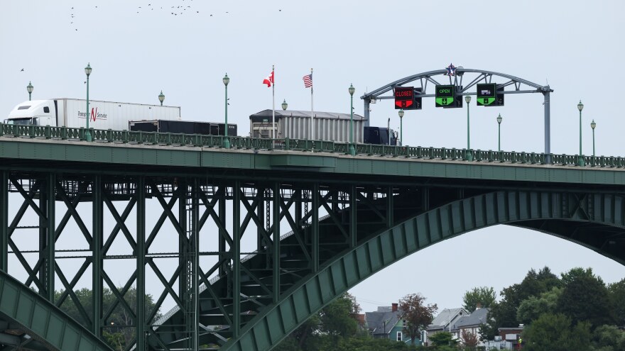 Tractor trailers cross the Peace Bridge at the Canada-United States border in Fort Erie, Ontario, Canada, on Aug. 20.