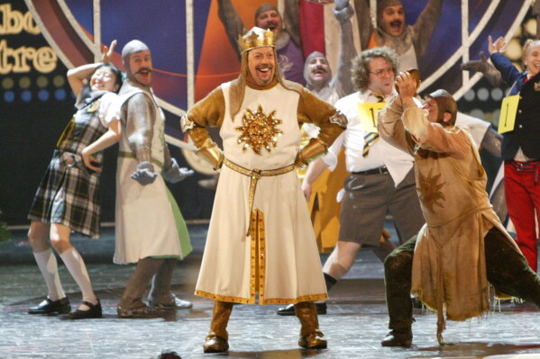 Tim Curry, center, appears with cast members from nominated Broadway productions at the 2005 Tony Awards at Radio City Music Hall in New York on June 5, 2005. (AP Photo/Kathy Willens, File)