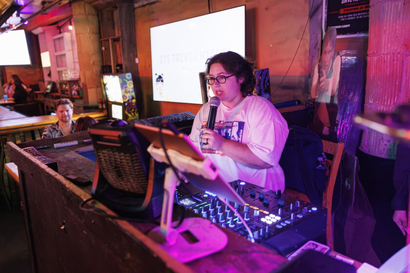 Mollie Menuck, 25, manager at KPOP Merch by Choc Choc, hosts trivia night at Replay in Lake View on Tuesday.