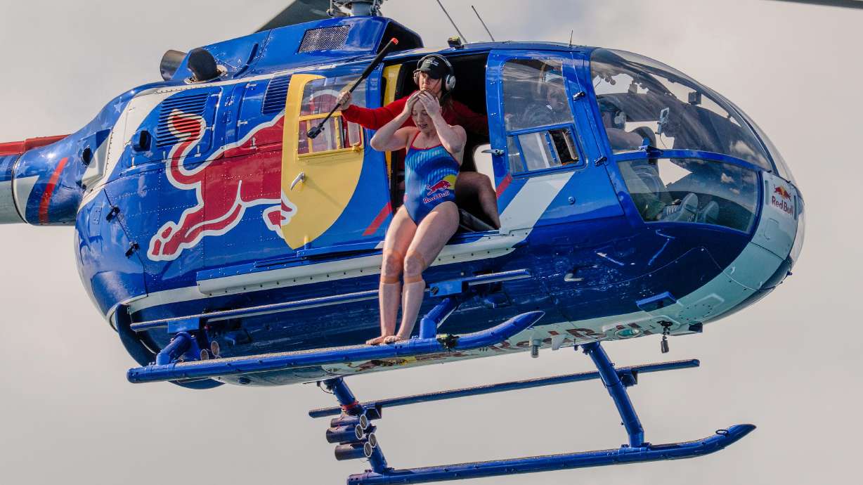 Have You Seen This? Professional cliff diver jumps from helicopter into shark-filled waters