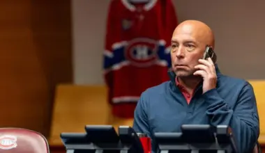 Photo of Montreal Canadiens general manager Kent Hughes on the phone during the NHL draft.