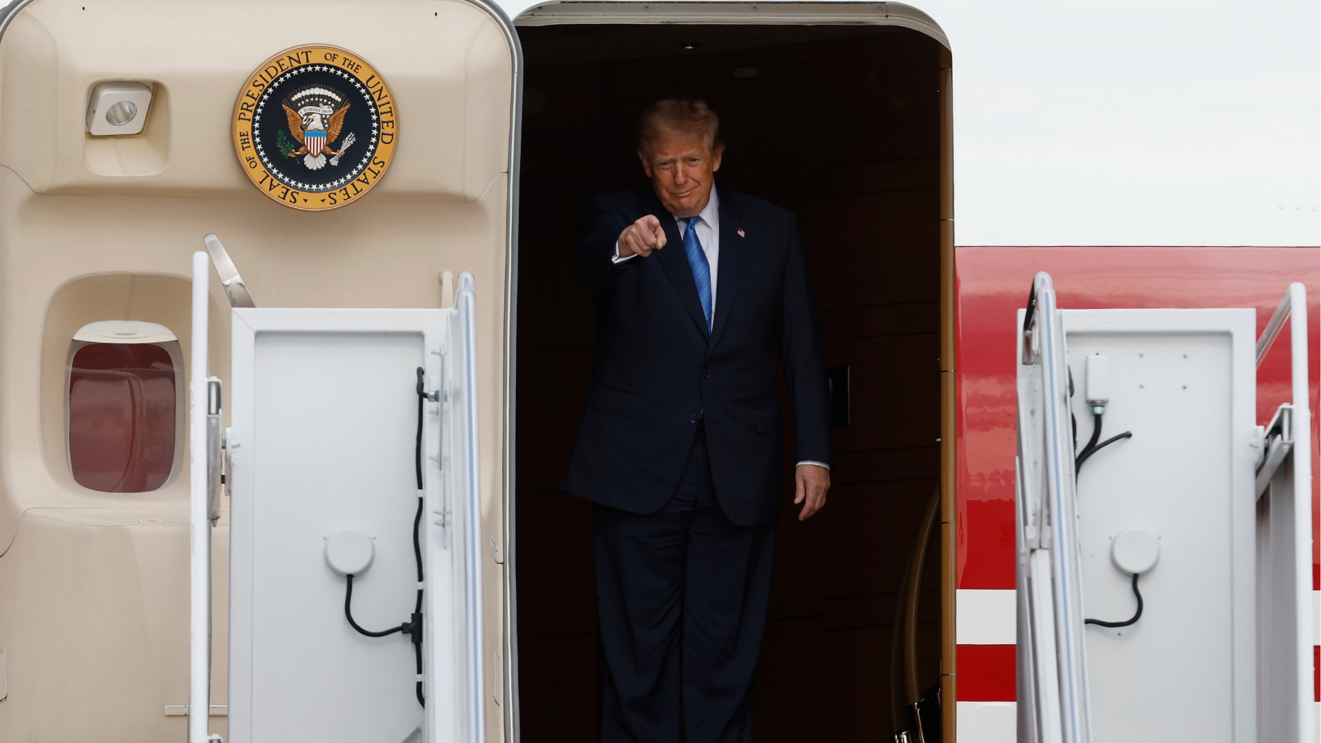 President Donald Trump gestures as he disembarks Air Force One upon his arrival at Joint Base Andrews, Md, Friday, Aug. 28, 2026.