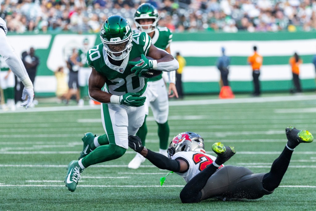 Jets running back Breece Hall (20) runs with the ball in the first half at MetLife Stadium in East Rutherford, New Jersey, Friday, August 14, 2026.
